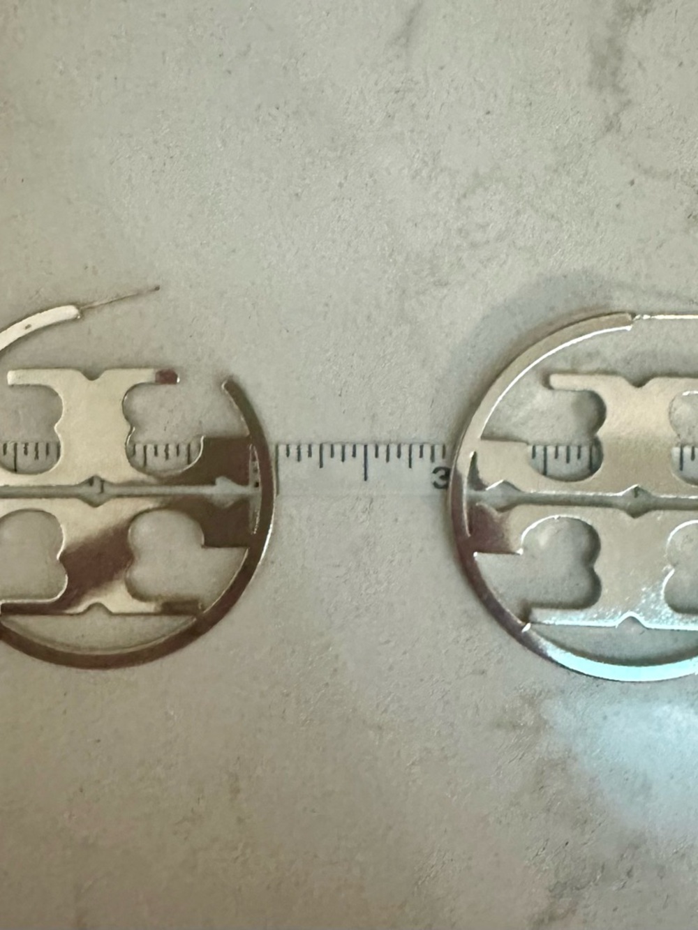 Tory Burch Logo Cutout Hoop Earrings in Shiny Silver - Picture 3 of 3